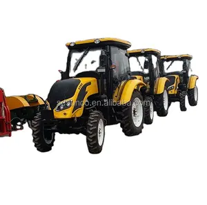 65 hp tractor met implementeren loader, backhoe en logging trailer