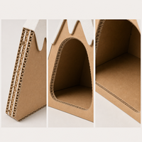 Maison pour chat en carton ondulé, type grotte de montagne enneigée, avec deux pics, fenêtre en forme de patte et boule suspendue