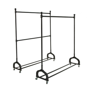 Porte-vêtements mobile à double rail avec roulettes pour les tenues des enfants et des femmes dans les boutiques - Product Image 5
