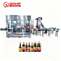 Machine de remplissage entièrement automatique de haute précision, personnalisée par le fabricant, pour la ligne d'embouteillage sous vide de la sauce soja et des liqueurs