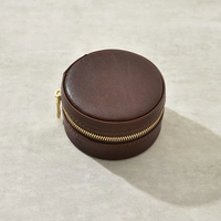 Étui à bijoux de voyage rond en cuir PU, boîte cylindrique à fermeture éclair, intérieur en velours, mini rangement pour bagues et boucles d'oreilles, vente en gros, personnalisation OEM