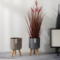 Pot de fleur en plastique vintage de haute qualité jardinière d'arbre ronde décorative avec pieds en bois pour sol maison bureau intérieur vente en gros