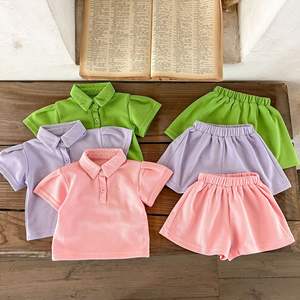 Ensemble de vêtements pour filles 2 pièces, nouveau modèle 2024 - Haut et jupe de couleur unie avec découpes - Product Image 2