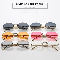 Lunettes de soleil ovales sans monture pour femme, protection UV400, branches en métal incrustées de perles, verres découpés en forme de chaîne, idéales pour les fêtes et la plage