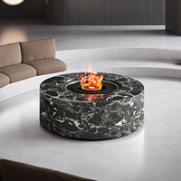 Brasero rond noir contemporain autoportant avec flammes modernes et faux bûches pour villas et hôtels – Cheminée paysagère