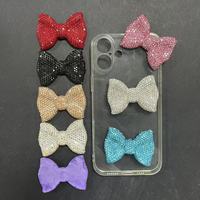 En gros, breloques de luxe scintillantes avec motifs nœud, signe du dollar, rose, rouge, bleu, noir, argenté, pour coques de téléphone, coques d'iPad, style Kawaii et artisanat DIY