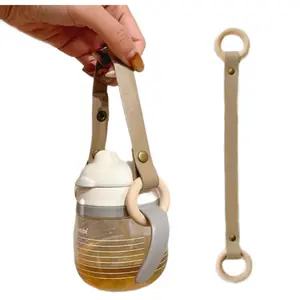 Elegante soporte para botella de agua con correa de cuero pu accesorios para artículos de bebé soporte para chupete correa para portabotellas