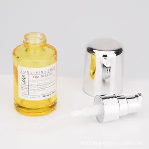 Customization Essential Glass bottles 30ml press the emulsion bottle skin care cream in clear yellow and green