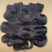 100% extensions de cheveux bouclés naturels Tape Ins Extensions cheveux crus