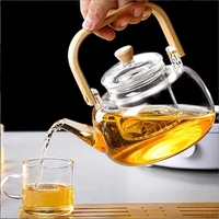 Théière en verre résistant à la chaleur avec poignée en bambou faite à la main en verre à haute teneur en borosilicate avec passoire en verre 900ml