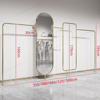 Porte-vêtements mural en métal doré, dernier cri, magasin de vêtements résistant, meilleure qualité