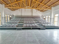 Frog Sports Factory fournit des gradins télescopiques rétractables en acier inoxydable électriques et mobiles sur mesure pour stades.