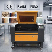 Machine de gravure et de découpe au laser CO2 ActionLasers 6090 pour acrylique et plastique - Haute précision, protection des yeux, refroidissement par eau