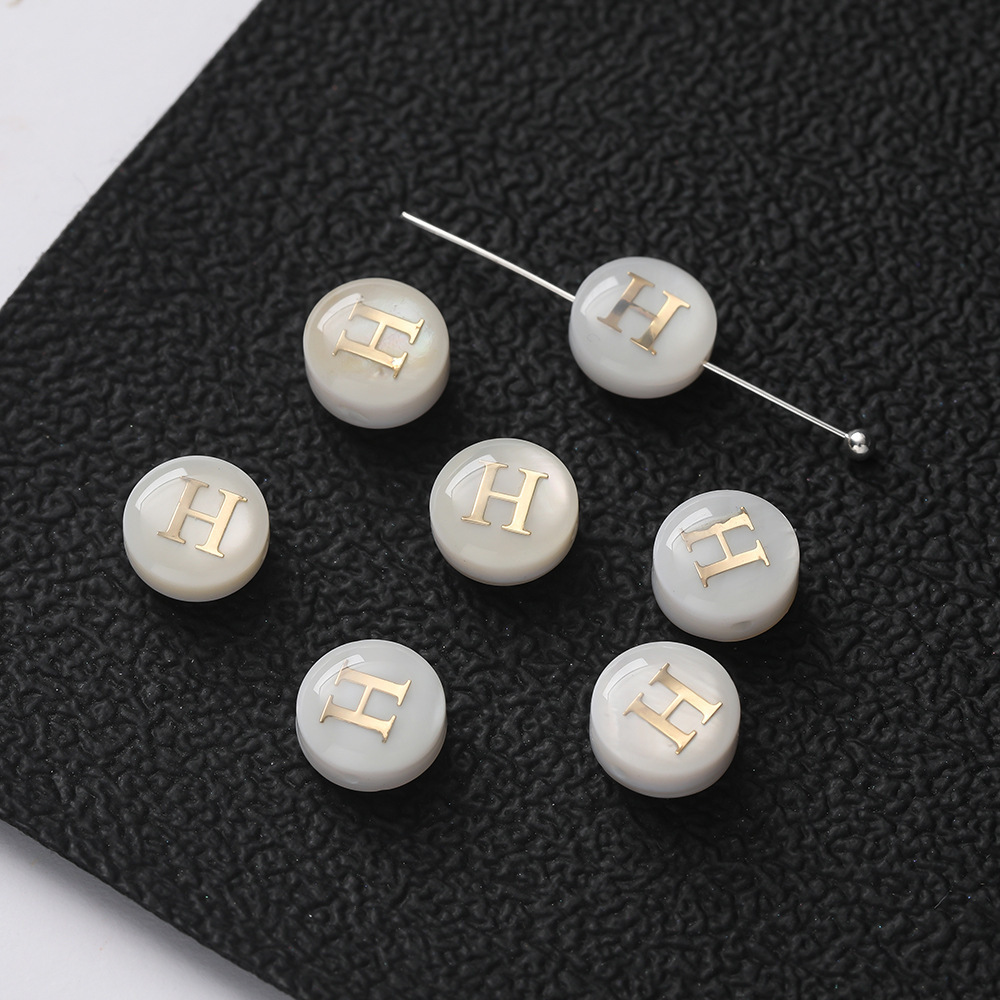 Perles lettres coquillages -- H
