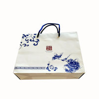Sacs en papier personnalisés de luxe blancs avec logo imprimé sur mesure pour vos achats et cadeaux
