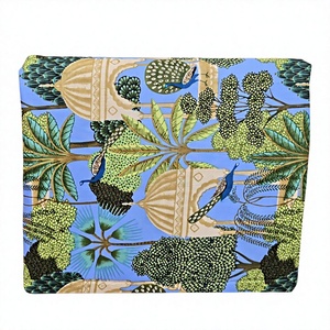 Premium pure cotton sky blue fabric features majestic royal peacock motifs amid traditional palace domes and lush palm <b>tree</b> - Product Image 1