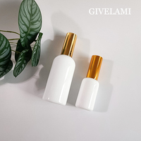 Vente en gros de flacons pulvérisateurs en verre transparent blanc de forme ronde de 15 ml, 30 ml, 50 ml, 100 ml avec pulvérisateur doré