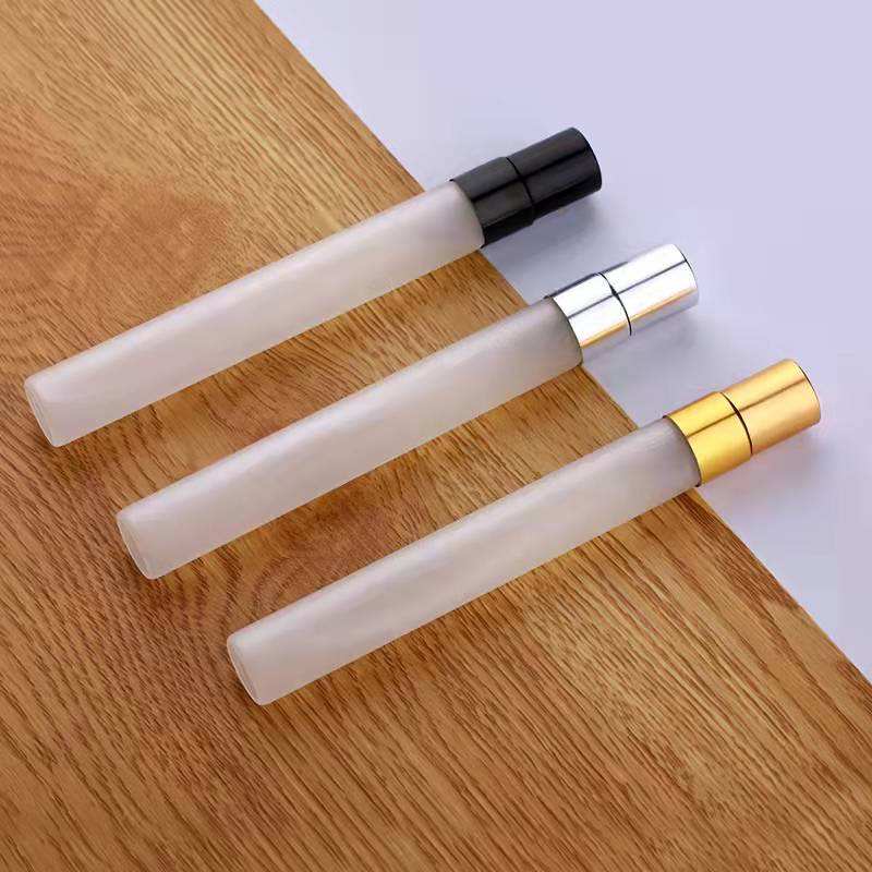 frosted perfume bottle with black sprayer