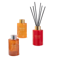 Vente en gros de flacons ronds en verre de 100 ml pour parfum d'ambiance avec bâtonnet en bois et bouchon de couleur rouge-orange