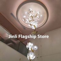 Lustre en feuille de lotus tout en cuivre Forme artistique Nouveau plafonnier long de style chinois pour hôtel villa escalier restaurant Design