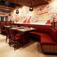 Ensemble de mobilier moderne et durable pour restaurant commercial : banquette demi-cercle avec structure en bois et revêtement en cuir, table, chaise et canapé pour restaurant de fondue