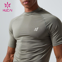 HUCAI Logo personnalisé Spandex léger pour hommes Compression active Muscle Dry Fit t Shirt Gym Shirt pour hommes