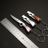Couteau pliant de poche Mini porte-clés couteau Portable survie en plein air outil d'urgence déballage pliable en acier inoxydable EDC porte-clés