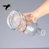 Bouteille de tequila en verre cylindrique de 700 ml avec logo personnalisé, design doré estampé à chaud, base lourde, bouteille de liqueur haut de gamme, prête à diffuser