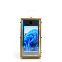 Photomaton intégré dans un cabinet, style borne interactive, avec éclairage RGB et imprimante dissimulée, idéal pour les événements commerciaux
