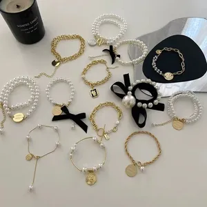 18K oro placcato Vintage Pop fiocco braccialetto di perle semplice quotidiano stile personalizzato per il commercio all'ingrosso nero anello orologi