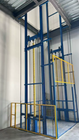 Ascenseur de fret vertical hydraulique avec rail de guidage et chaîne de levage à ciseaux, alimentation CA pour hôtels et construction (mini) Hauteur de levage 3m