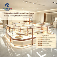 Kiosque de présentation de bijoux de luxe sur mesure en or rose, vitrine à bijoux en verre éclairée par LED, comptoir d'îlot pour bijouterie de centre commercial