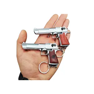 Wholesale metal gun model eject bullets keychain pubg colt m1911 toy gun for kids keychain 1911 toy gun