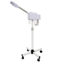 Appareil de beauté facial à vapeur chaude Stand Nano avec base à roulettes pour une infusion profonde d'humidité dans les couches sèches de la peau