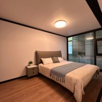 Maison conteneur modulaire préfabriquée extensible à double aile de 30 pieds, à température constante, haute sécurité et personnalisable, avec grand espace