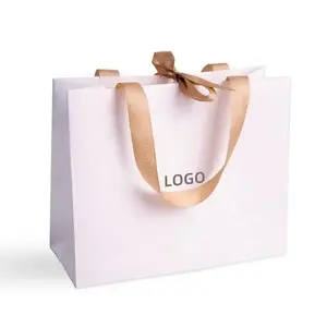 Borsa della spesa di carta del regalo di imballaggio rosa della boutique della scarpa di logo su ordinazione di marca di lusso per i vestiti