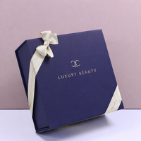 Boîte rigide en forme de livre avec fermeture magnétique bleu marine de luxe personnalisée avec du papier de soie pour l'emballage de cosmétiques haut de gamme