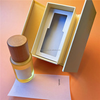 Emballage en papier rigide avec impression de conception de forme de logo de taille personnalisée Boîtes cadeaux de bouteille d'huile essentielle de parfum à ouverture bilatérale magnétique
