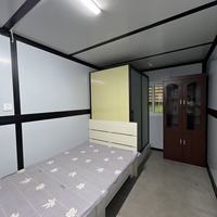 Maisons conteneurs pliables et préfabriquées de haute qualité, couleur gris foncé, 20 pieds, à faible coût, en forme de X
