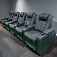 Diseño moderno negro Home Theater Asientos Power Reposacabezas Home Theater Uso especial Muebles de teatro Sofá con tableta de escritura
