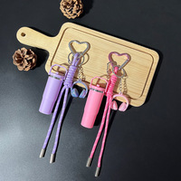 Porte-clés mini-rouge à lèvres en plastique avec cordon, joli pendentif pour écouteurs, tube de rangement portable et étanche pour baume à lèvres pour femmes