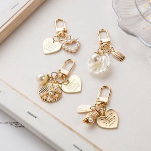 Elegant Letter Label Women Girls Pearls <b>Key</b> <b>Chain</b> Handbag Hanging Pendant Keyring Heart Shell Pendant Keychain - Product Image 2