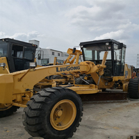 Niveleuse Caterpillar 140H d'occasion en excellent état, modèle 2022, pour la construction routière, avec moteur, pompe et boîte de vitesses disponibles à la vente