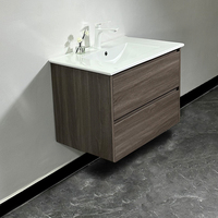 Kabinet Kamar Mandi Mengambang Motif Kayu Gelap dengan Wastafel Putih Terintegrasi Dua Laci Furnitur Proyek Hotel Villa Kustom