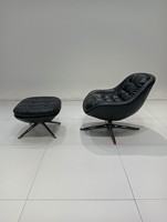 Fauteuil d'appoint pivotant en tissu avec un design minimaliste pour un salon de luxe