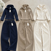 Ensemble de survêtement deux pièces en tissu éponge pour femme, veste à capuche entièrement zippée et pantalon de jogging, couleur unie, tenue décontractée, sélection pour commandes en gros