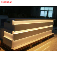 Livraison rapide à Foshan Meubles sur mesure Surface solide Pierre Led Wellness Area Comptoirs de réception