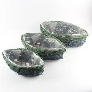 Nuovi disegni di cestini a forma di barca fioriere e vasi da appendere popolari in rattan verde all'aperto alti all'ingrosso