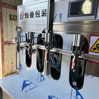 Machine de remplissage semi-automatique à piston à quatre têtes pour détergent à lessive en bouteille et en fût, désinfectant pour les mains