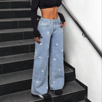 Jean large taille haute pour femme avec nœud décoratif, effet usé, coupe décontractée, style streetwear, personnalisable OEM 2026